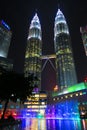 Modern Petronas twin towers Kuala Lumpur Malaysia by night with colorful fountain Royalty Free Stock Photo