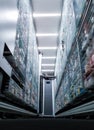 Modern pharmacy concept of storage room functioning with one robot hand.