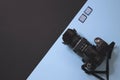 Modern photography camera and memory on black and blue background