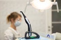 A modern photopolymerization lamp for light fillings in the dental office, on a blurred background Royalty Free Stock Photo