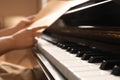 Modern piano with black and white keys, closeup. Space for text