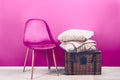 Modern Pink Velour Chair with Beige Cushions and Throw