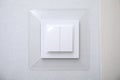 Modern plastic light switch on white wall, closeup Royalty Free Stock Photo