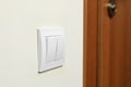 Modern plastic light switch on white wall indoors, closeup Royalty Free Stock Photo