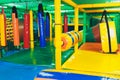 Modern playground indoor. Kids jungle in a play room. Round tunnel in children gym. Royalty Free Stock Photo