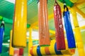 Modern playground indoor. Kids jungle in a play room. Round tunnel in children gym.