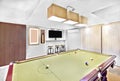 Modern pool table in luxury room with furniture Royalty Free Stock Photo