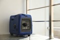 Modern portable power station on floor indoors Royalty Free Stock Photo