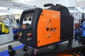 Modern portable semi automatic welding machine Jasic presented on stand in the exhibition hall. Industry exhibition