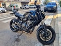 Modern powerful black sport motorcycle YAMAHA MT-07 is parked on a city street Royalty Free Stock Photo
