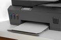 Modern printer with paper on white table, closeup Royalty Free Stock Photo
