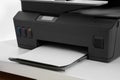 Modern printer with paper on white table, closeup Royalty Free Stock Photo