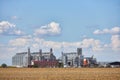 Modern processing complex of grain crops on background of blue sky