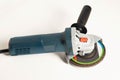 Modern professional angle grinder with a flap wheel on a white background. Power tool for work. Sanding wood and metal