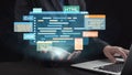 Modern programmer using laptop with floating programming languages interface in abstract graphic design showcasing Royalty Free Stock Photo