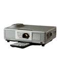 A modern projector with its remote control, ideal for presentations and meetings Royalty Free Stock Photo