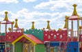 Modern public playground against the blue sky. A colorful play and sports complex for children without people. Equipment for rock Royalty Free Stock Photo