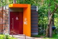 Modern public toilet in city park. Toilet with icons: disabled person, female, male. toilet sign, WC Royalty Free Stock Photo