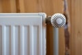 Modern radiator in room with wooden wall and cozy interior Royalty Free Stock Photo