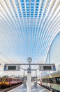 Modern railway station with transparent ceiling and blue sky