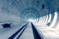 Modern railway tunnel with green signal light