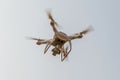 Modern RC Drone / Quadcopter with camera flying in a bright and clear blue sky. New technology in the aero photo shooting Royalty Free Stock Photo