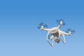 Modern RC Drone / Quadcopter with camera flying at sunrise Royalty Free Stock Photo