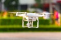 Modern RC Drone / Quadcopter with camera flying at sunrise Royalty Free Stock Photo