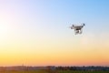 Modern RC UAV Drone / Quadcopter with camera flying on a clear s Royalty Free Stock Photo
