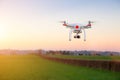 Modern RC UAV Drone / Quadcopter with camera flying on a clear s Royalty Free Stock Photo