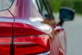 Modern rear light of a car. Brake light and arrow of large suv. Royalty Free Stock Photo