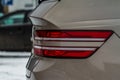 Modern rear light of a car. Brake light and arrow of large suv. Royalty Free Stock Photo