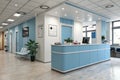 Modern reception desk with computer in blue medical office interior Royalty Free Stock Photo