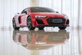 Modern Red Audi R8 Sport Plus in studio isolated on a white background