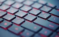 Modern red backlit keyboard, concept computer background Royalty Free Stock Photo