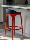 Modern red bar stool in contemporary kitchen setting Royalty Free Stock Photo