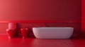Modern red bathroom interior with white bathtub, toilet, and bidet Royalty Free Stock Photo