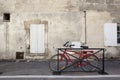 Modern red bicycle in front of an old house Royalty Free Stock Photo
