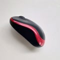 Modern red and black wireless mouse computer.  on white ceramic background. Royalty Free Stock Photo