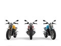 Modern red, blue and yellow chopper motorcycles - front view Royalty Free Stock Photo