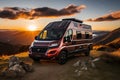 Modern red camper house on wheels in the mountains at sunset, summer travel concept Royalty Free Stock Photo