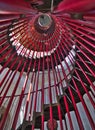 Modern red iron spiral staircase  in old castle tower. Royalty Free Stock Photo