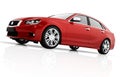 Modern red metallic sedan car in spotlight. Generic desing, brandless. Royalty Free Stock Photo