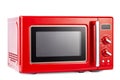 Modern red microwave oven for cooking food isolated on white background with clipping path Royalty Free Stock Photo