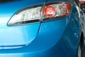 Modern red rear light of a blue car Royalty Free Stock Photo