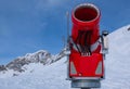 Modern red snow cannon in sunny day