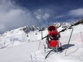 Modern red snow cannon in sunny day