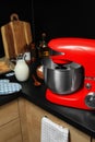 Modern red stand mixer and ingredients on countertop in kitchen Royalty Free Stock Photo