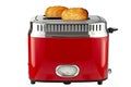 Modern red toaster with toasted bread for breakfast inside, isolated on white background. File contains clipping path Royalty Free Stock Photo