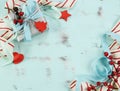 Modern red and white Christmas decorations on aqua blue wood background. Royalty Free Stock Photo